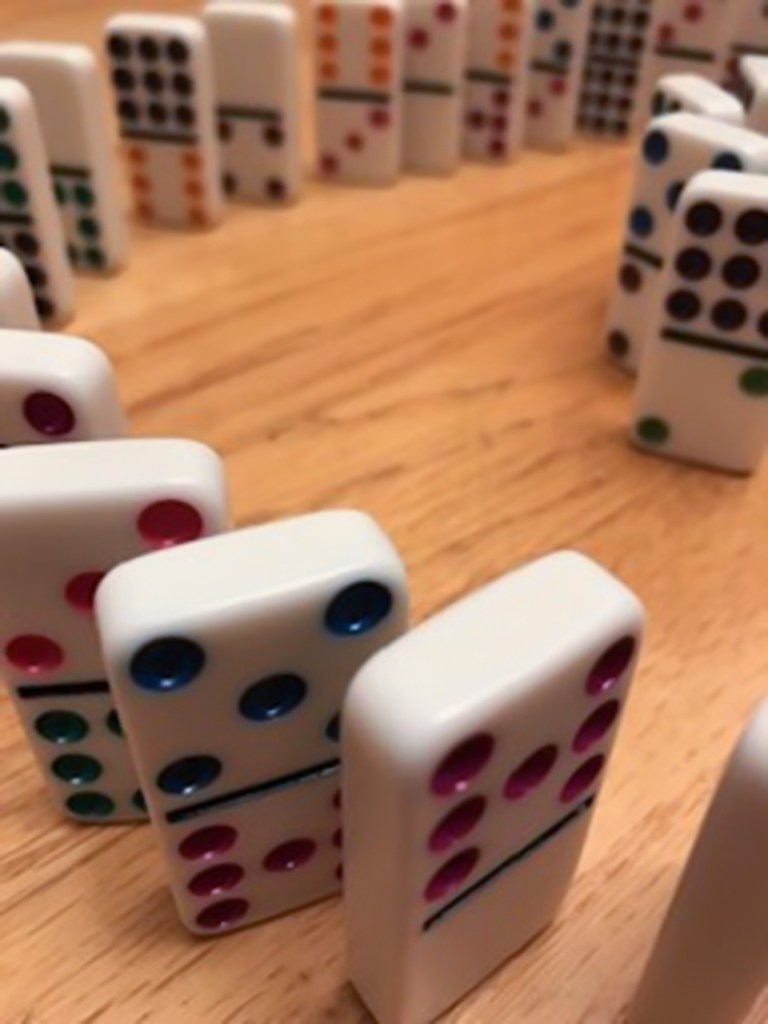8th grade student image of dominoes using aperture manipulation to express a shallow depth-of-field