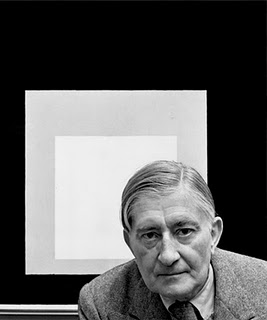 >Josef Albers with one of his paintings from the series Homage to the Square