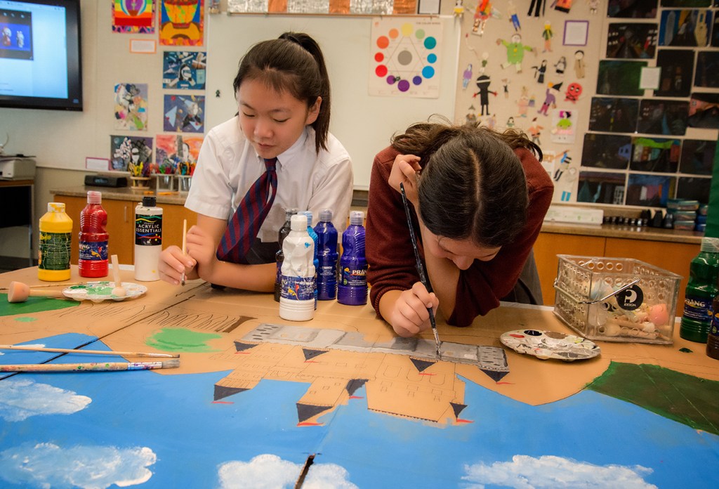 Here students are creating the set for a puppet show.