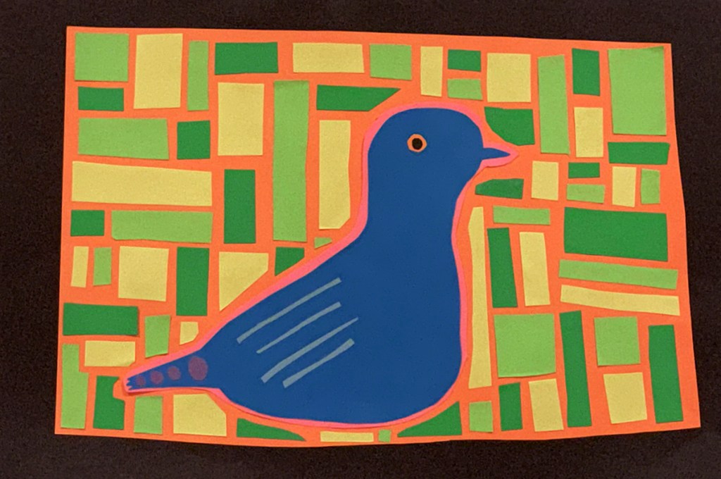 A 4th grade student Mola, depicting a blue dove with artistic patterns within its body, and surrounded by rectangles in various shades of green.