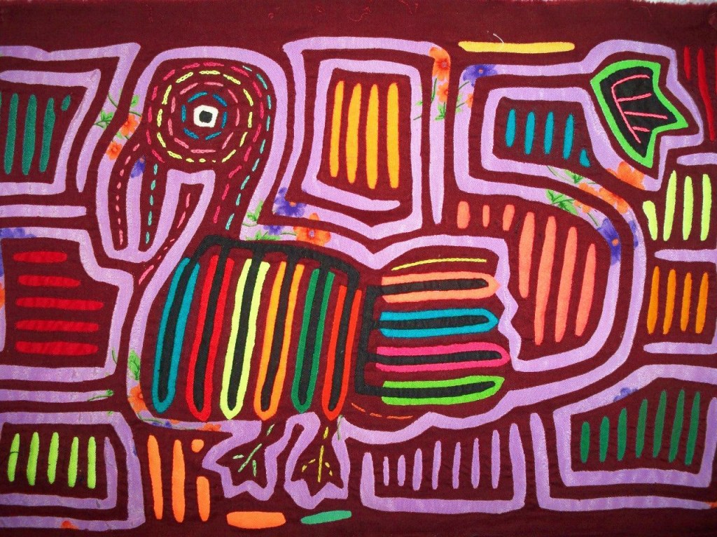 An example of a conventional Mola, depicting a bird surrounded by brightly colored patterns