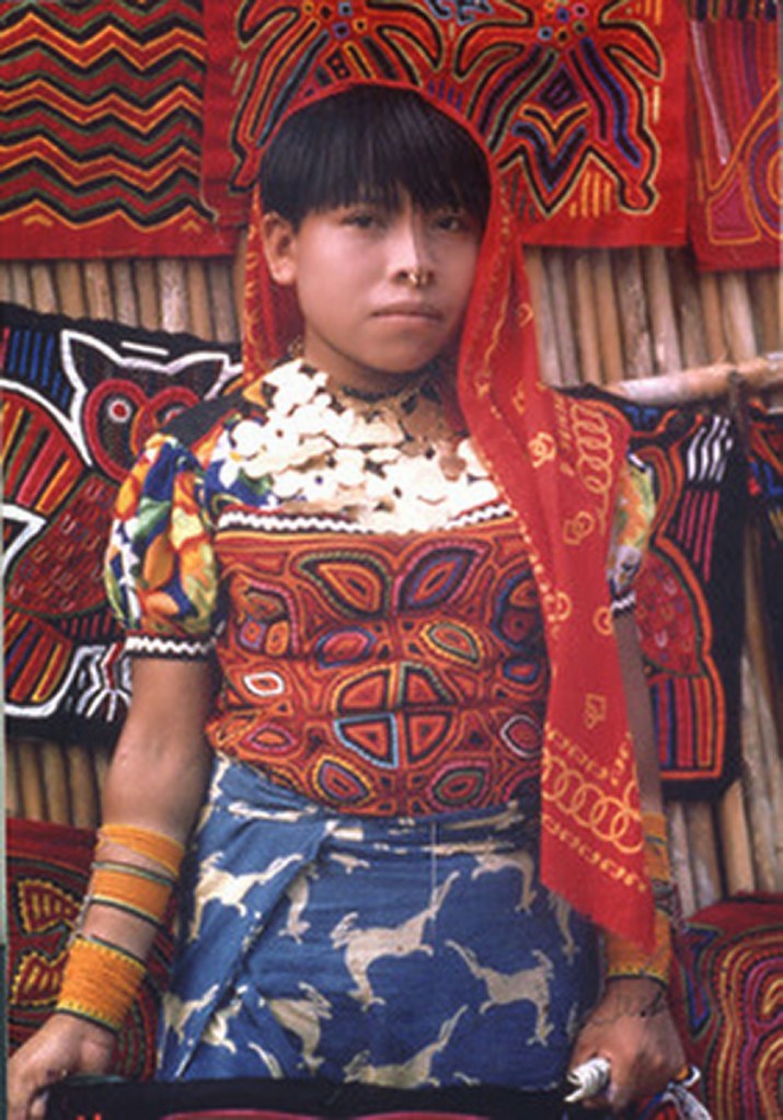 This is a Kuna woman of Panama wearing a traditional Mola around her chest