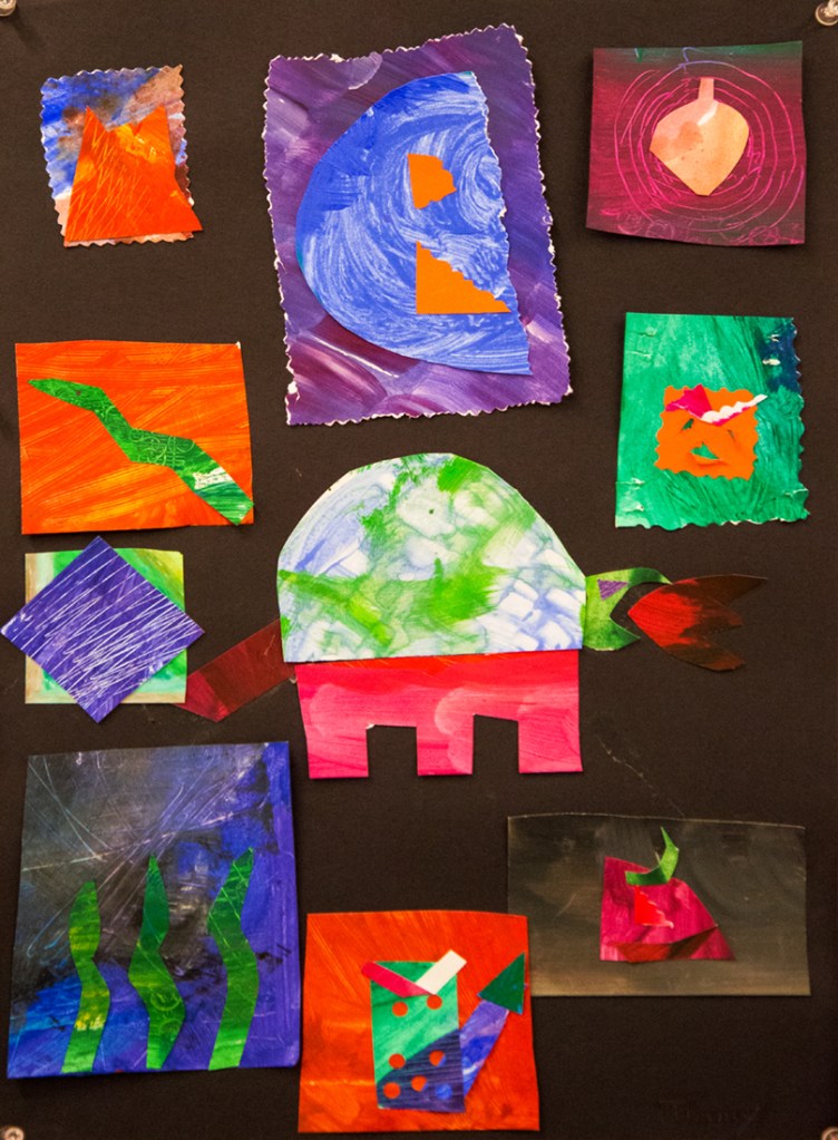 2nd grade student example of Matisse-Ray "style" Cut-out Collage with painted paper, books, magazines and other diverse stationary.