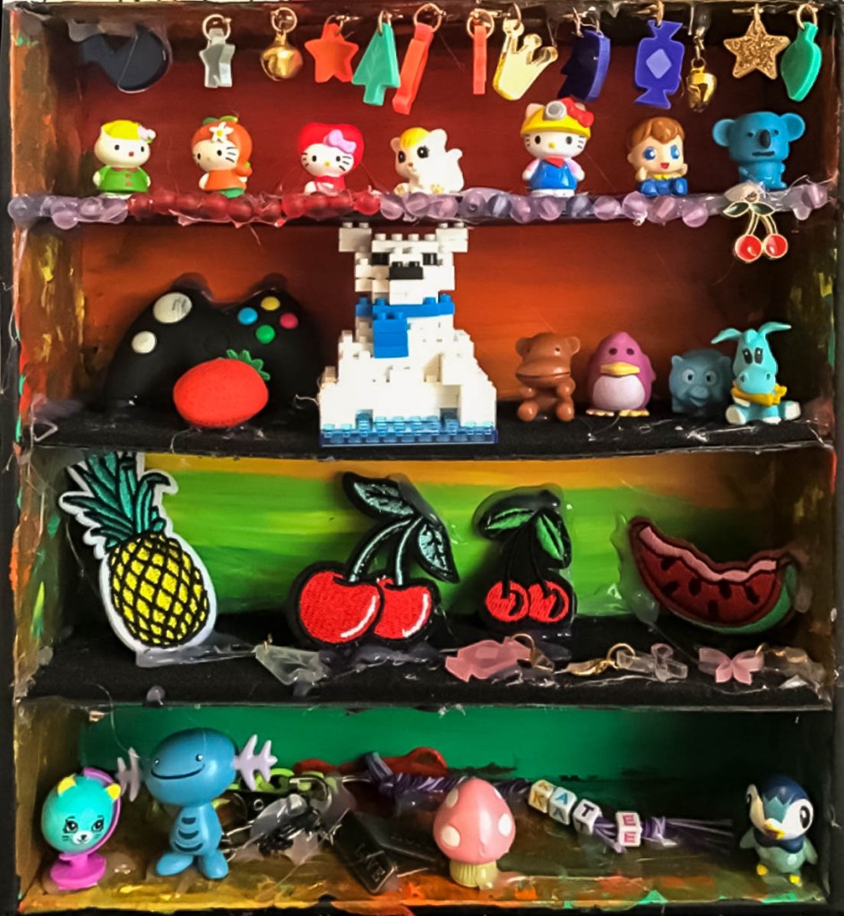 7th Grade Student's Cornell-Style Memory Box. This one contains figurines, toys, charms and patches.
