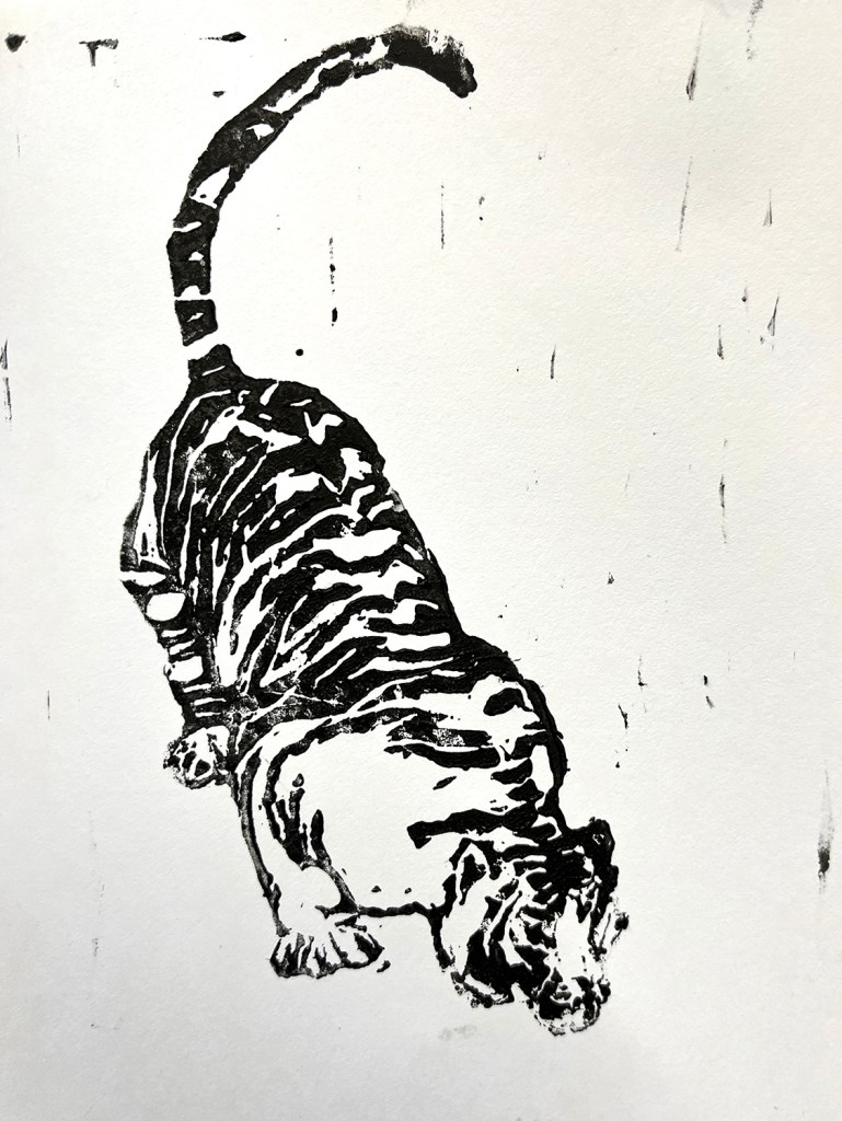 An 8th grade student's linoleum block print. This is a black and white print of a tiger.