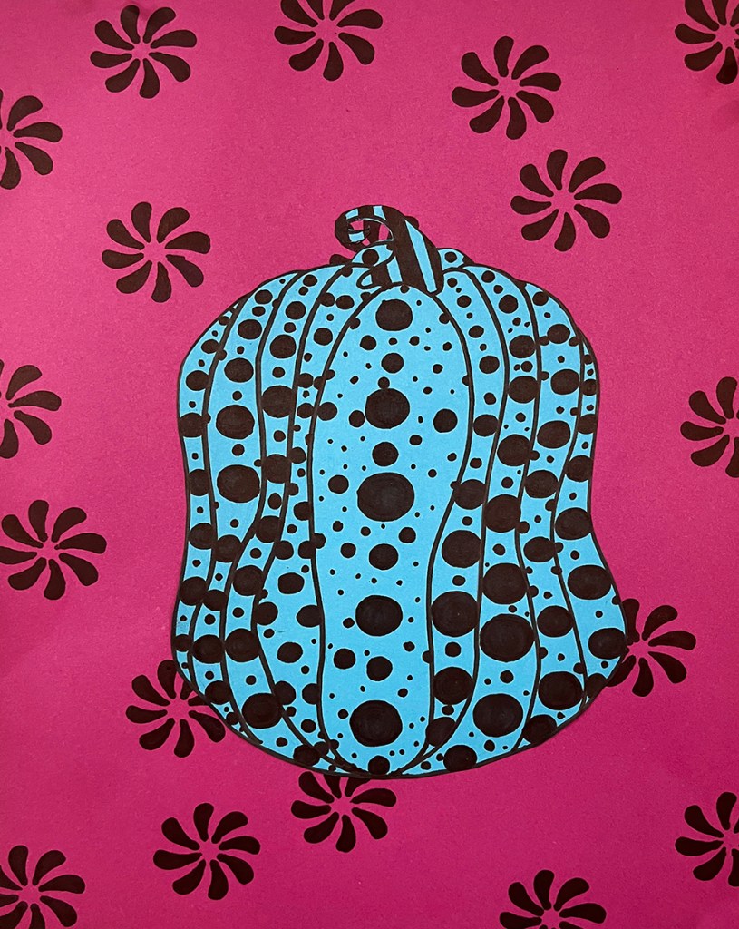 A 5th grade student's Yayoi Kusama-inspired pumpkin. A bright blue polka-dotted pumpkin on a magenta background with a black, floral pattern