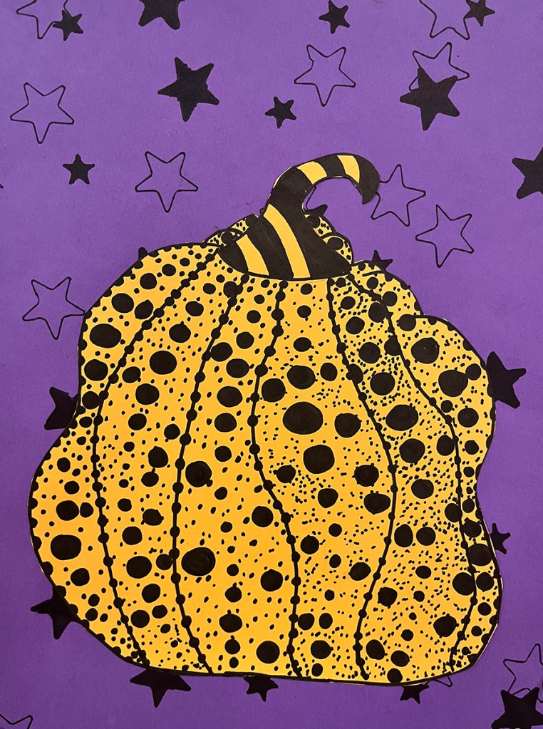 A 5th grade student's Yayoi Kusama-inspired pumpkin. A yellow polka-dotted pumpkin on a purple background with a pattern of black stars 